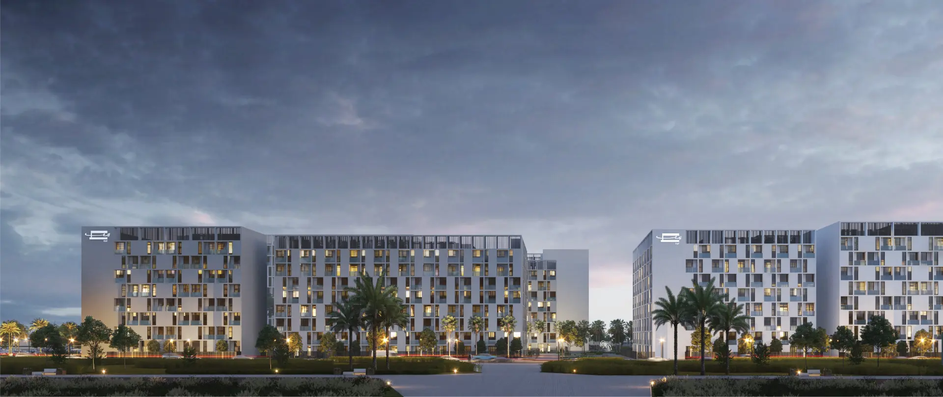 Modern mid-rise residential buildings at dusk in Al Mamsha, Sharjah